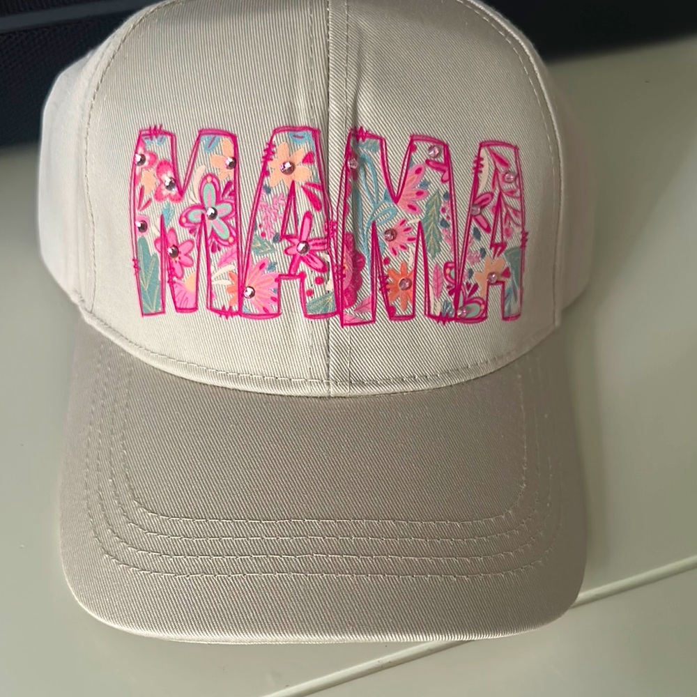 Floral 'MAMA' women’s hat with some bling and Velcro back to adjust what size.